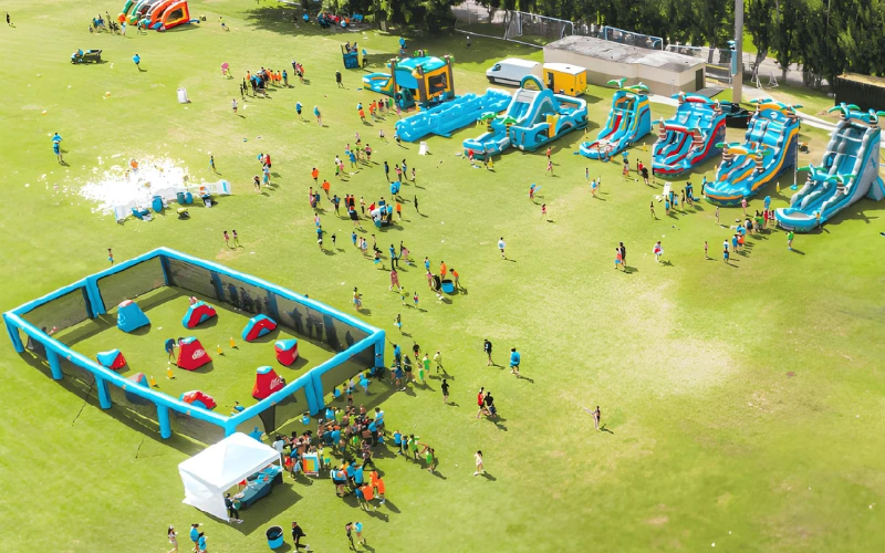 Event with inflatables, gellyball arena, and foam party