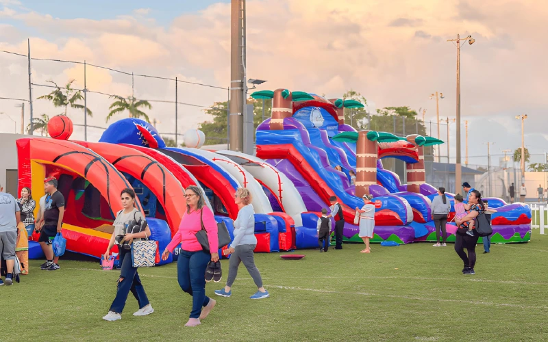 Sunset event with colorful water slides and inflatables
